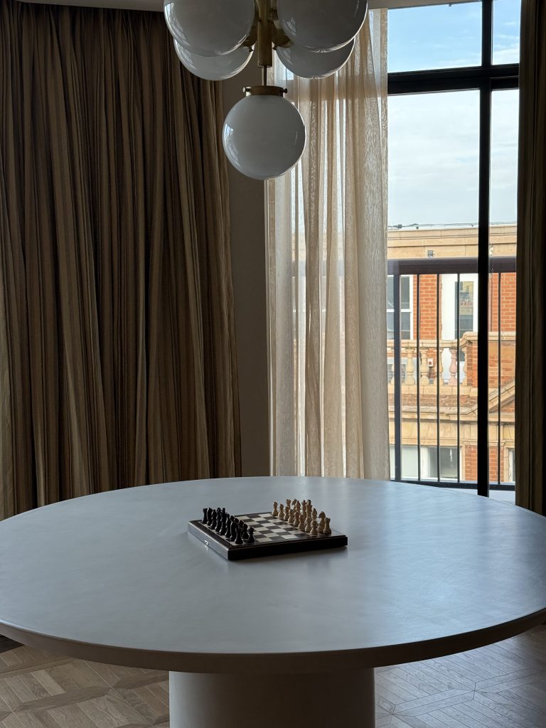 Round dining table for eight in the Newman hotel penthouse.